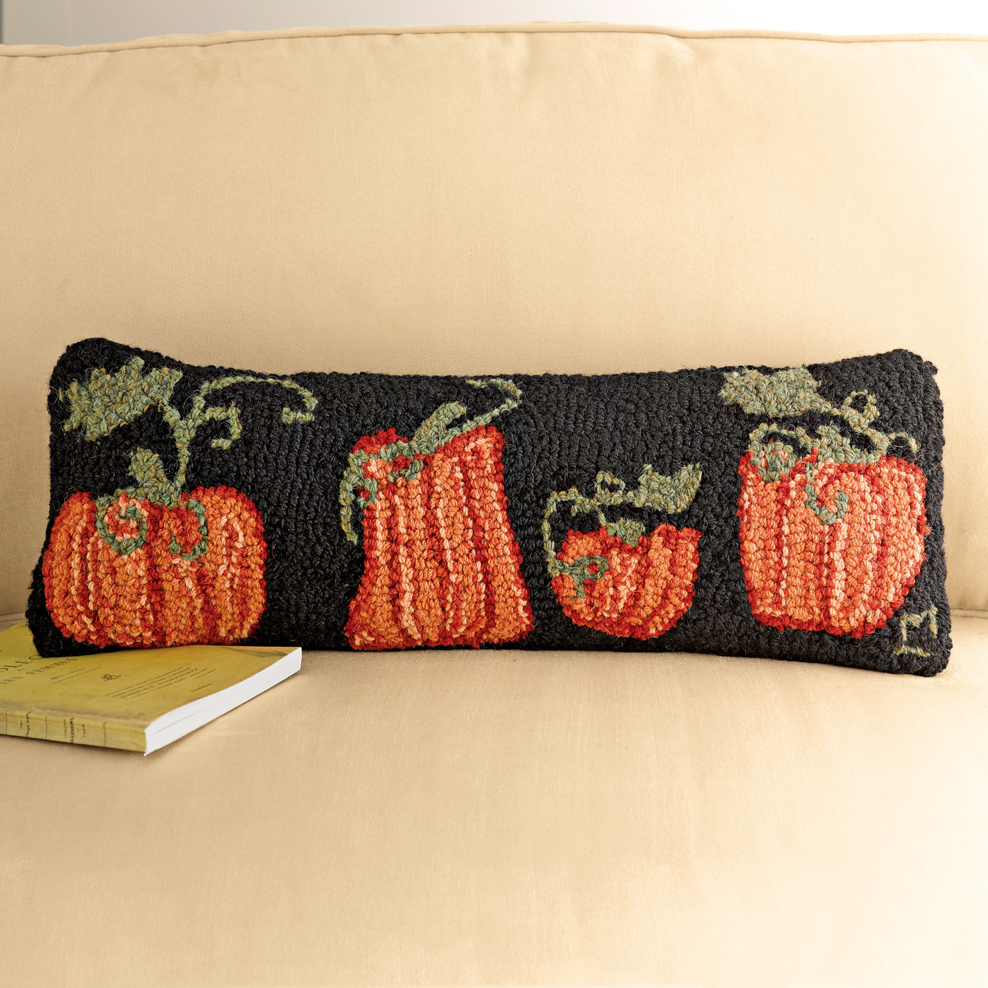 9. Warm And Inviting: Pumpkin Hooked Accent Pillow