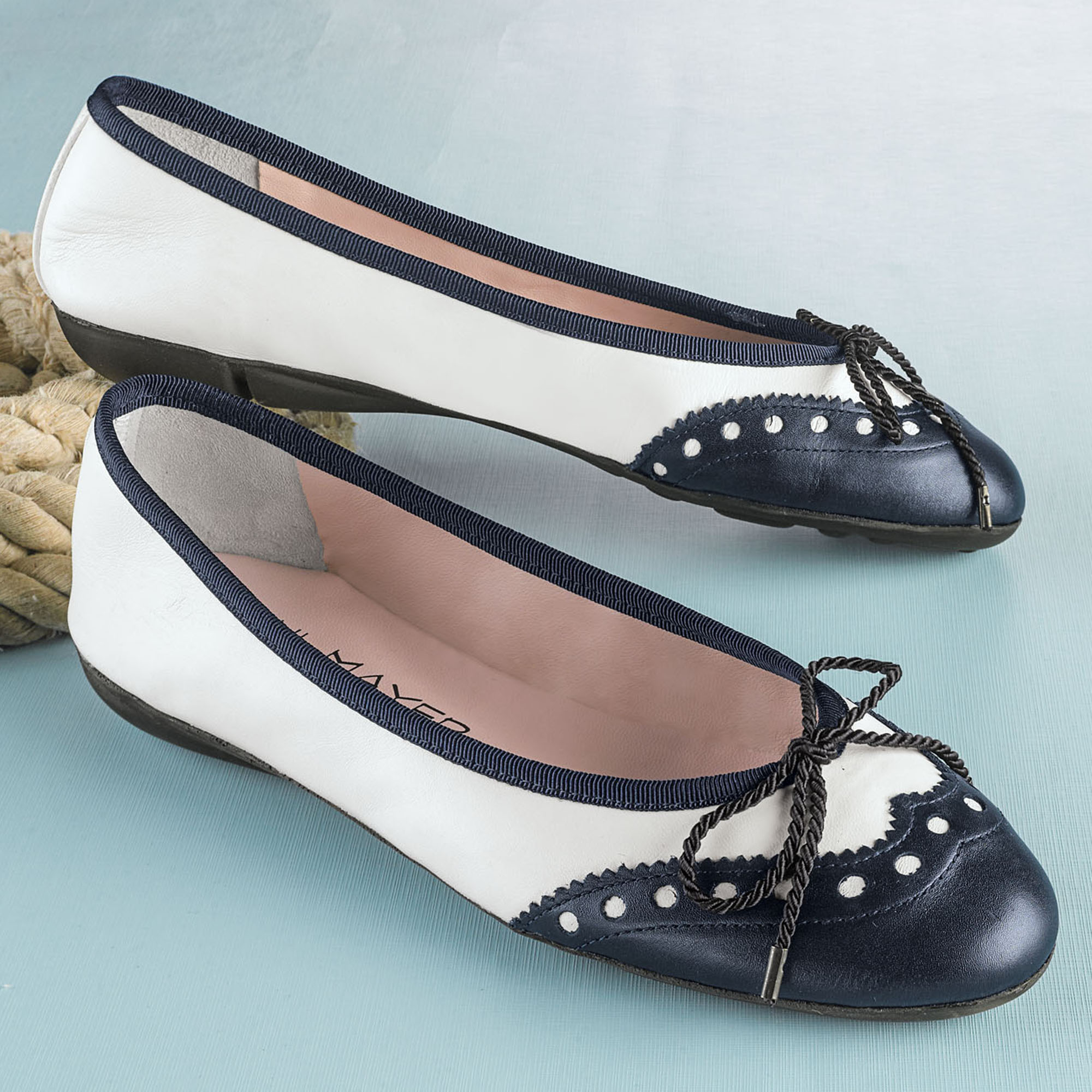 black and white spectator flats